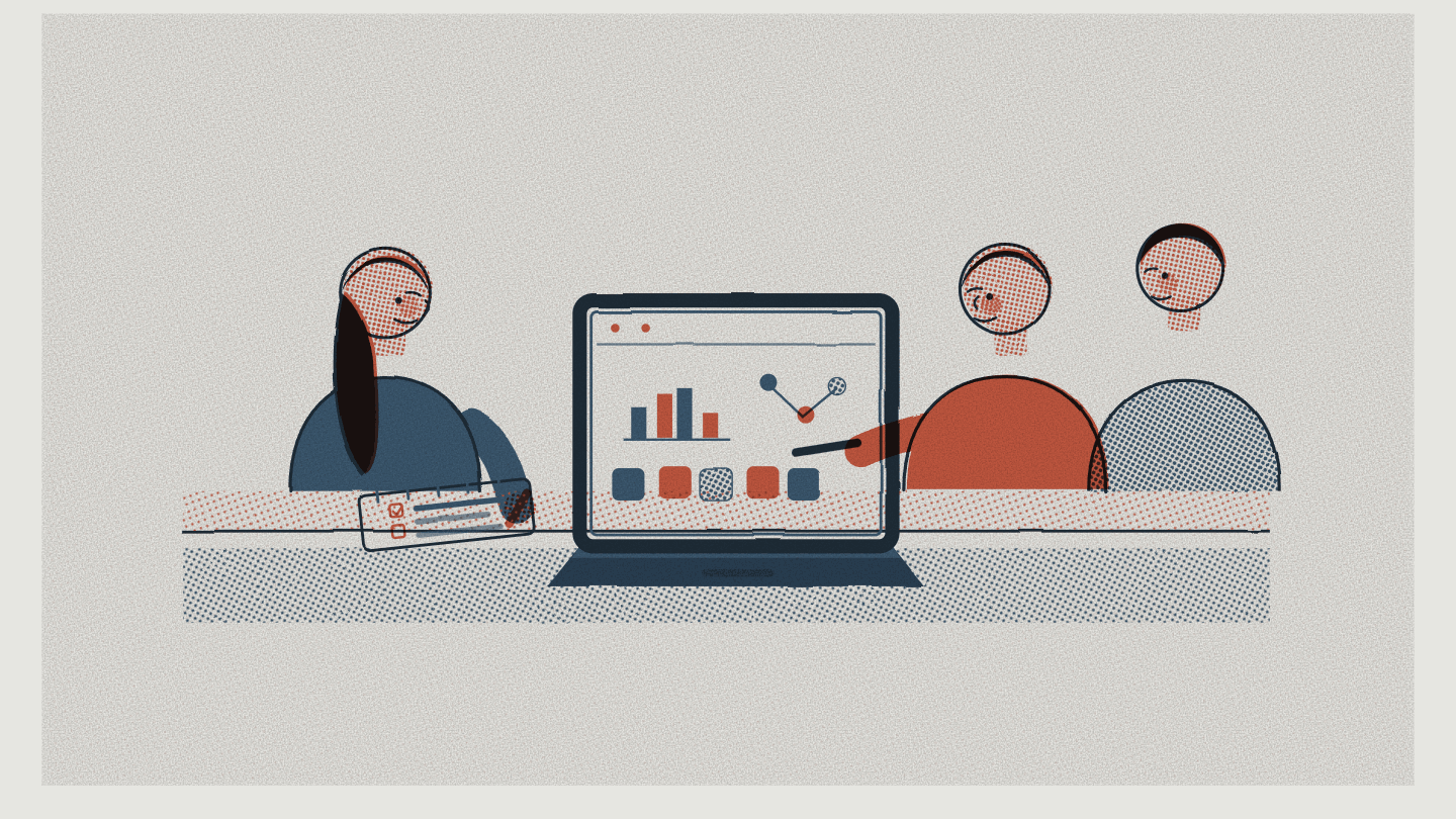 Three B2B colleagues seated around a laptop displaying an analytics dashboard with bar and line charts, with printed reports on the table.